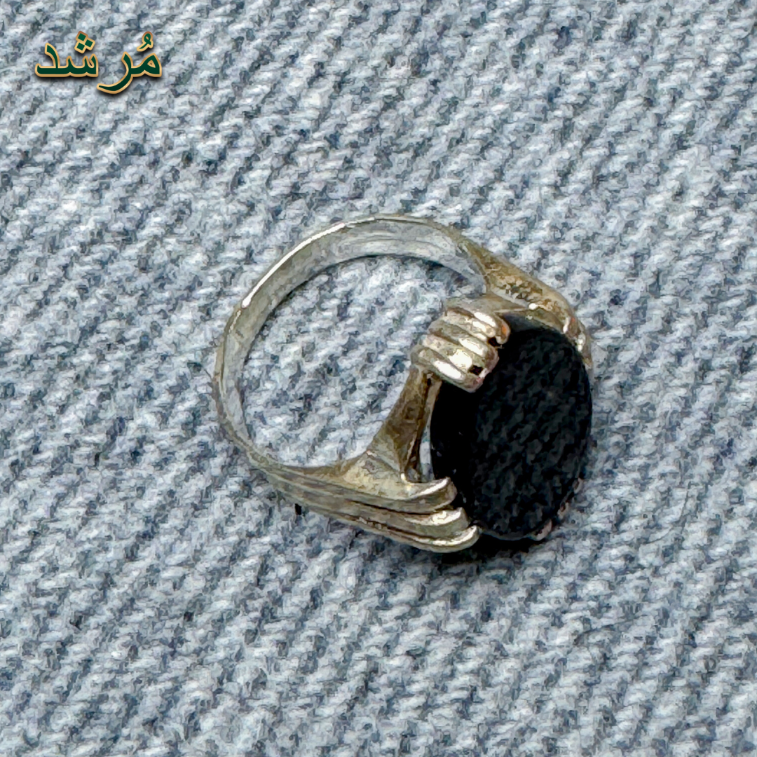 Silver ring with a black stone 